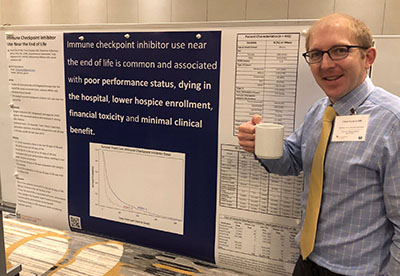 A fellow presenting a poster at a national meeting