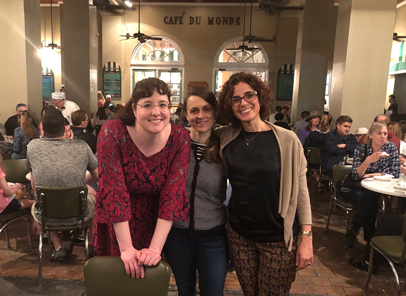 faculty and fellows at the Cafe du Monde