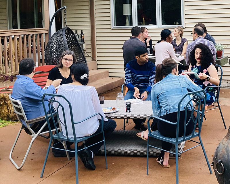 a groud of Endocrine faculty, fellows, and families at a casual ourdoor dinner