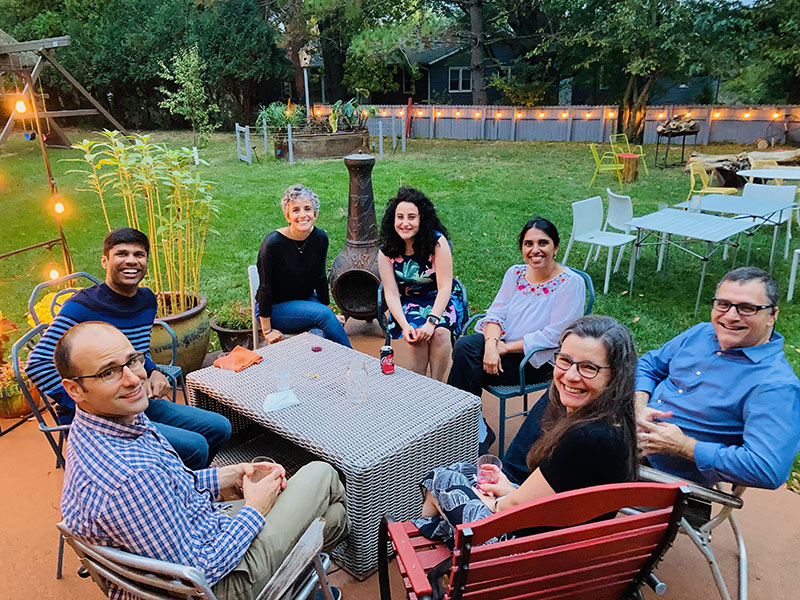 a groud of Endocrine faculty, fellows, and families at a casual ourdoor dinner