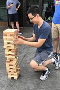 Resident playing giant Jenga at the annual retreat