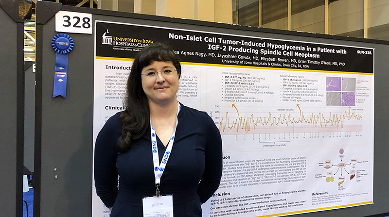 Dr. Rhea Nagy with her award-winning abstract poster, entitled "Non-Islet Cell Tumor-Induced Hypoglycemia in a Patient with IGF-2 Producing Spindle Cell Neoplasm."