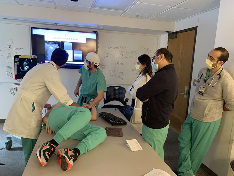 Physicians participating in hands-on ultrasound training