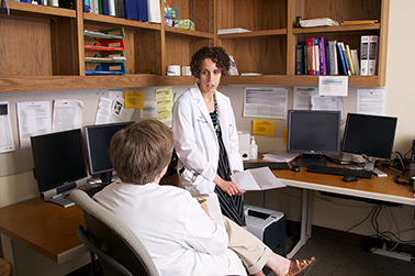 Resident consulting with faculty
