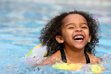 Young girl swimming in a pool