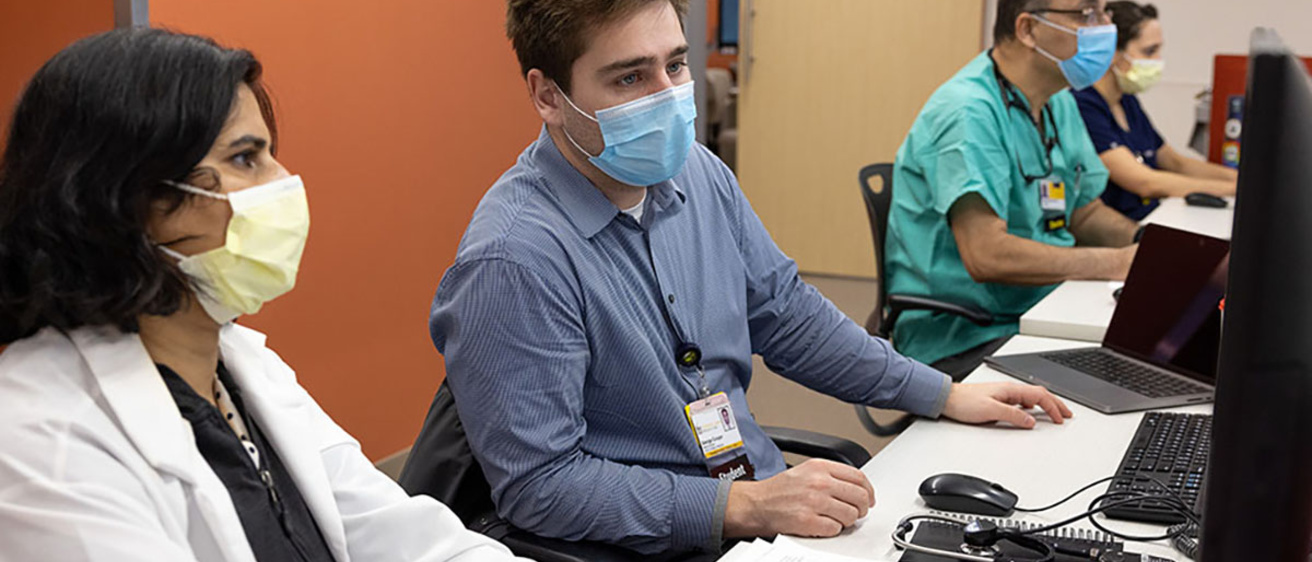 Advanced imaging fellows in the reviewing images in the workroom