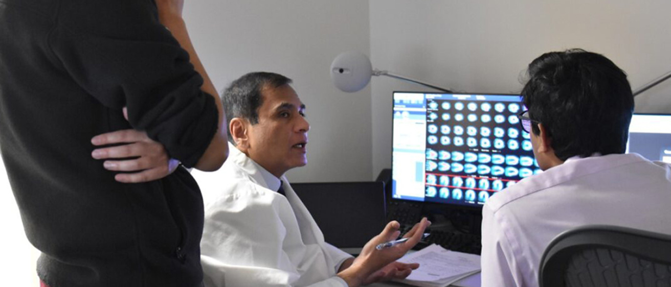 Cardiology fellows looking at imaging