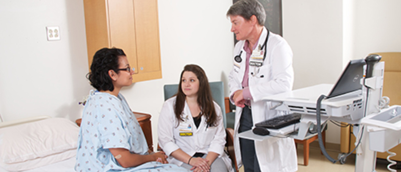 Resident andfaculty interviewing a patient