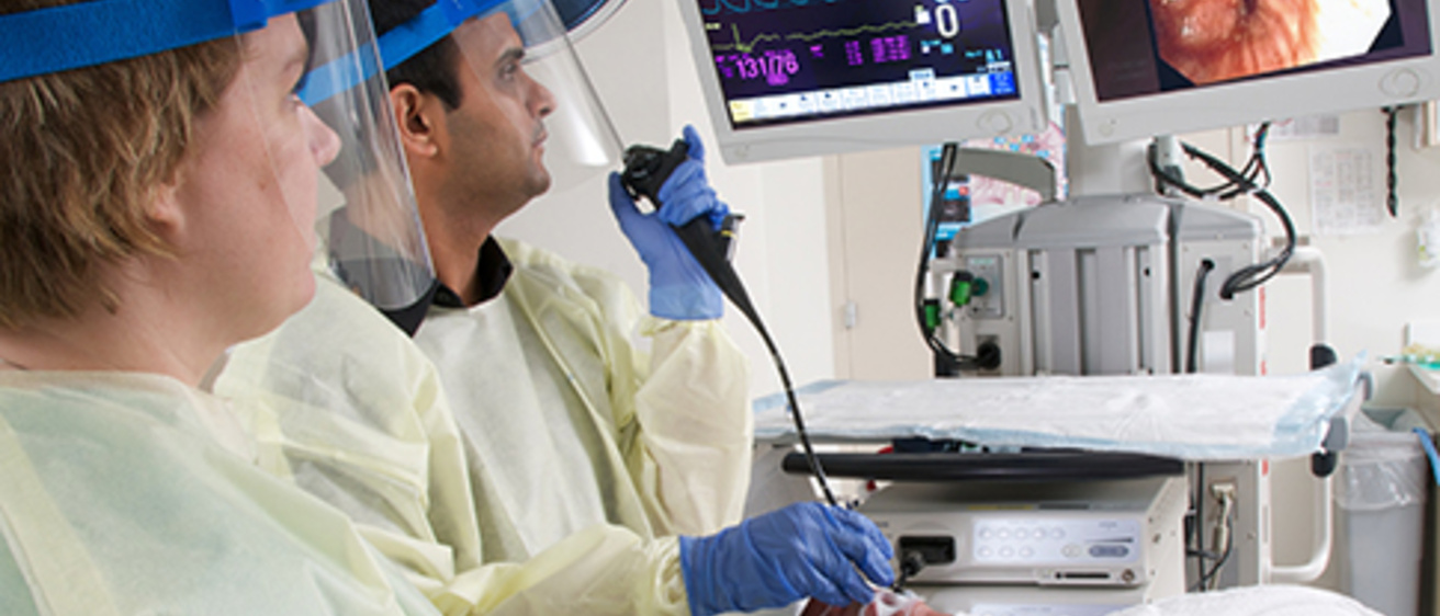 fellows and faculty performing a procedure