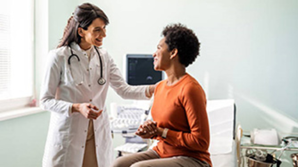 Doctor with a patient in an exam room